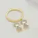 Anel Berloque Duas Meninas Cravejadas em Zircônia Folheado a Ouro 18K
