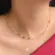 Gargantilha com Bolinhas de Cristais Coloridas Folheada a Ouro 18k
