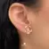Brinco Flor Vazada Zircônia Folheado a Ouro 18k