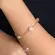 Pulseira Elos Cartier Pérolas e Bolas Folheada a Ouro 18K