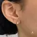 Argola de Click 10mm com Fileira de Pedras de Zircônia Folheada a Ouro 18k