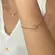 Pulseira Flor Margarida Com Zircônia Folheada a Ouro 18k