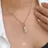 Pingente Menino Coração Verde Cravejado Com Zircônias Folheado a Ouro 18k