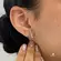 Brinco Palito Com Zircônias Folheado a Ouro 18k