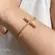 Pulseira Regulável Cruz Zircônia Folheada a Ouro 18k